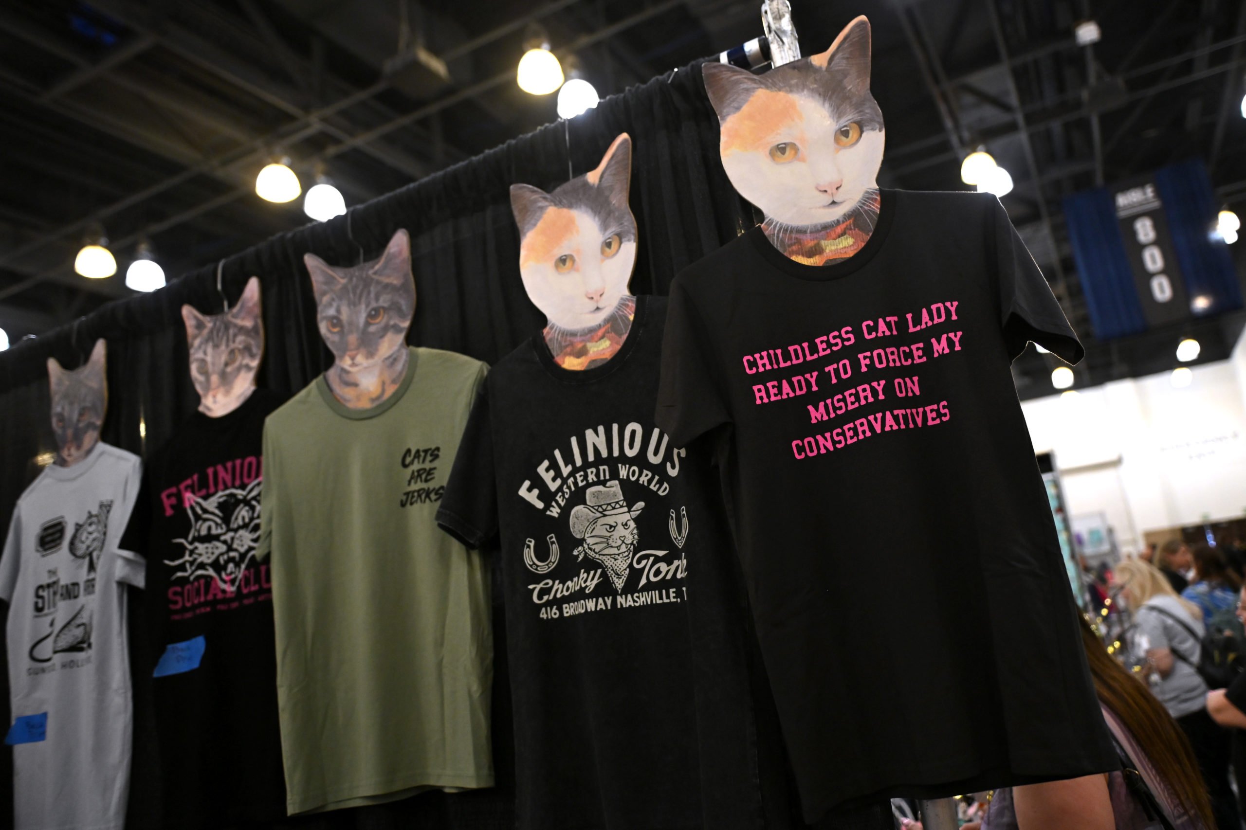 PASADENA, CALIFORNIA - AUGUST 03: Shirts are displayed at CatCon LA 2024 at Pasadena Convention Center on August 03, 2024 in Pasadena, California. (Photo by Sarah Morris/Getty Images)
