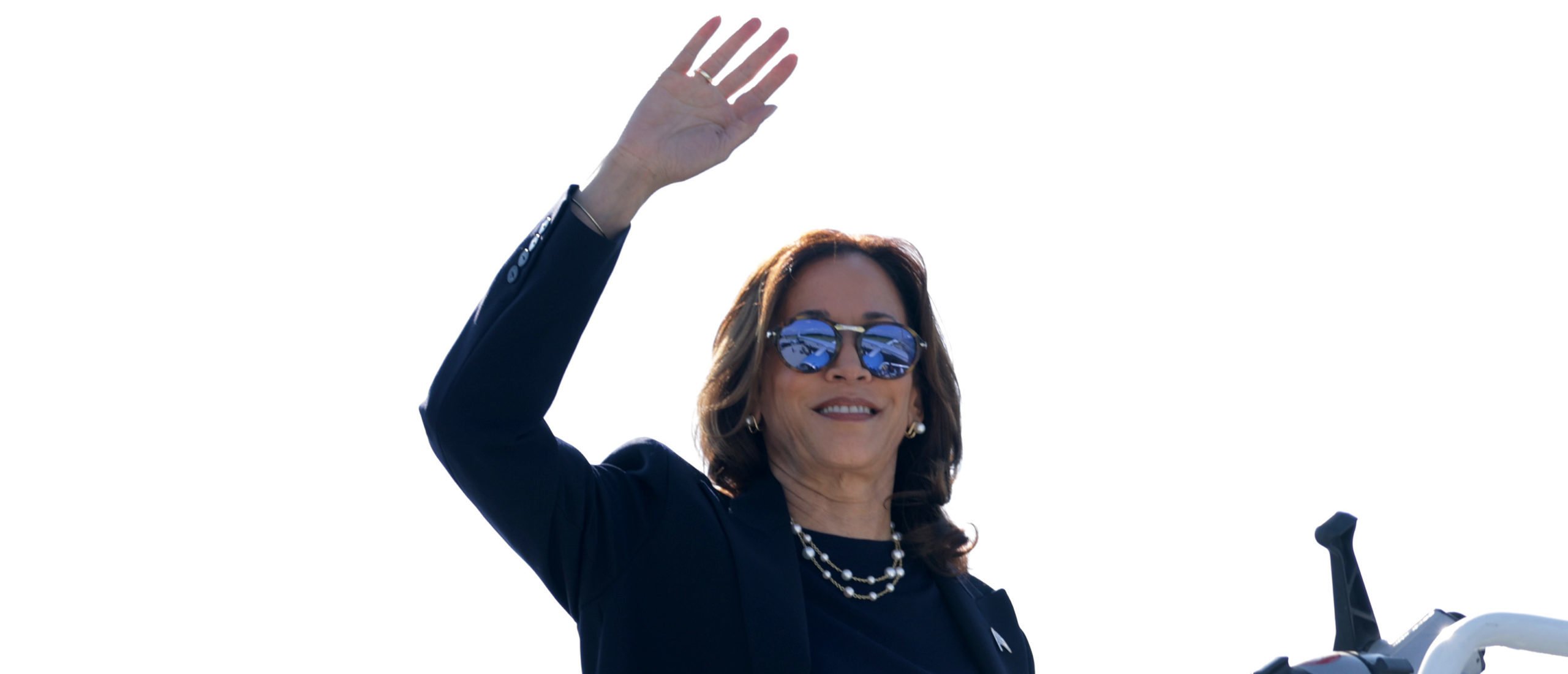 Democratic U.S. presidential candidate Vice President Kamala Harris waves as she boards Air Force Two prior to a departure at Detroit Metropolitan Wayne County Airport in Detroit, Michigan. Vice President Harris will continue to campaign in Arizona tomorrow. (Photo by Alex Wong/Getty Images)