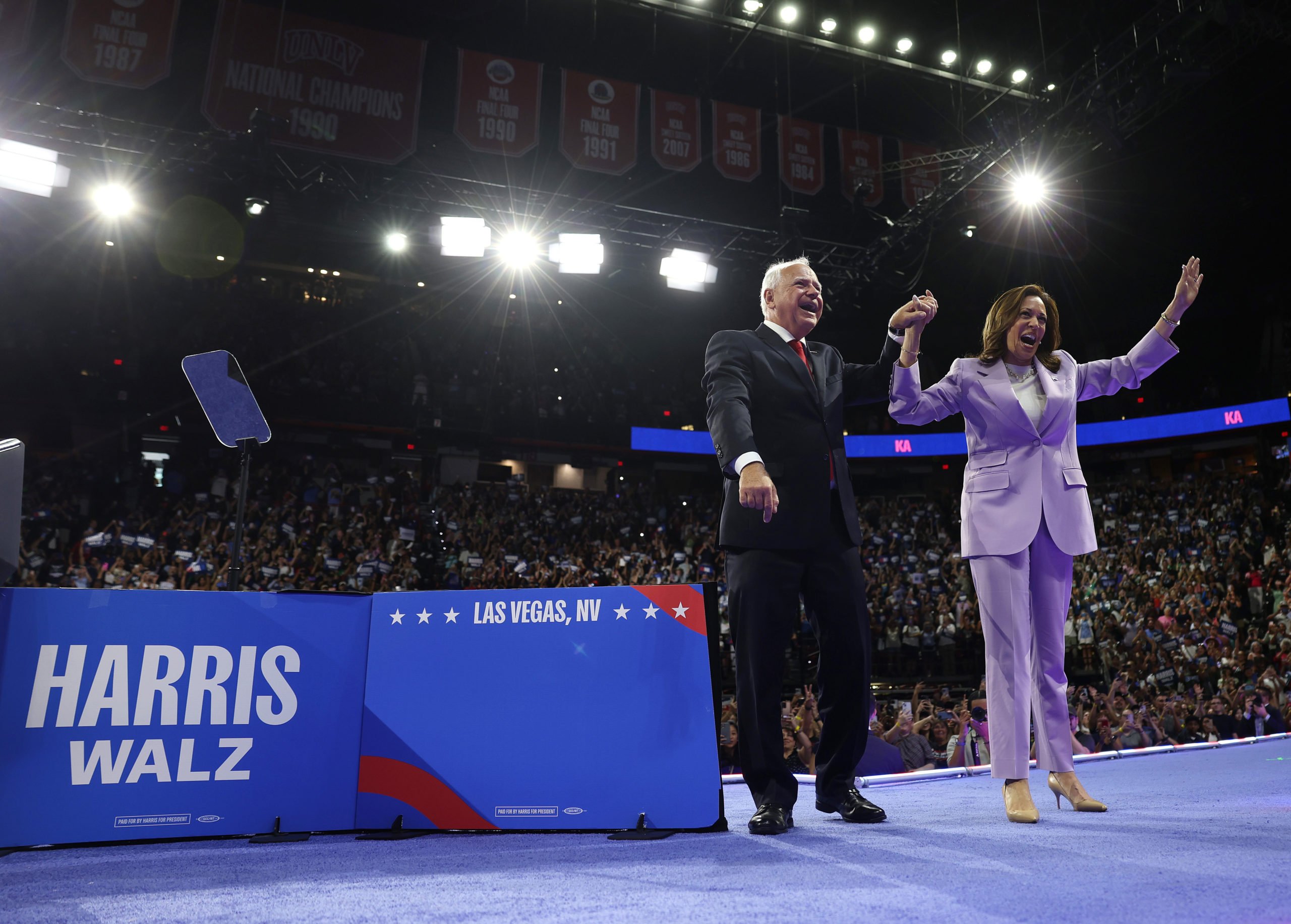 Democratic presidential candidate, U.S. Vice President Kamala Harris (R) and Democratic vice presidential candidate Minnesota Governor Tim Walz (L) appear at a campaign rally at the University of Las Vegas Thomas & Mack Center on August 10, 2024 in Las Vegas, Nevada. Kamala Harris and her newly selected running mate Tim Walz are campaigning across the country this week. (Photo by Justin Sullivan/Getty Images)