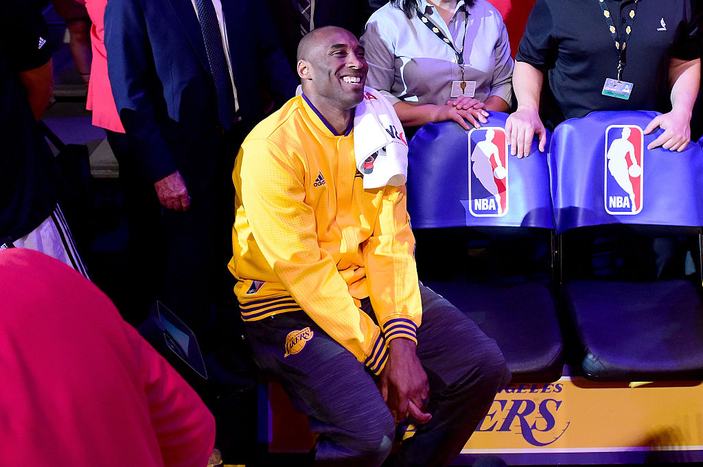 LOS ANGELES, CA - APRIL 13: Kobe Bryant #24 of the Los Angeles Lakers smiles as a video is being played before taking on the Utah Jazz in Bryant's final NBA game at Staples Center on April 13, 2016 in Los Angeles, California. NOTE TO USER: User expressly acknowledges and agrees that, by downloading and or using this photograph, User is consenting to the terms and conditions of the Getty Images License Agreement. (Photo by Harry How/Getty Images)