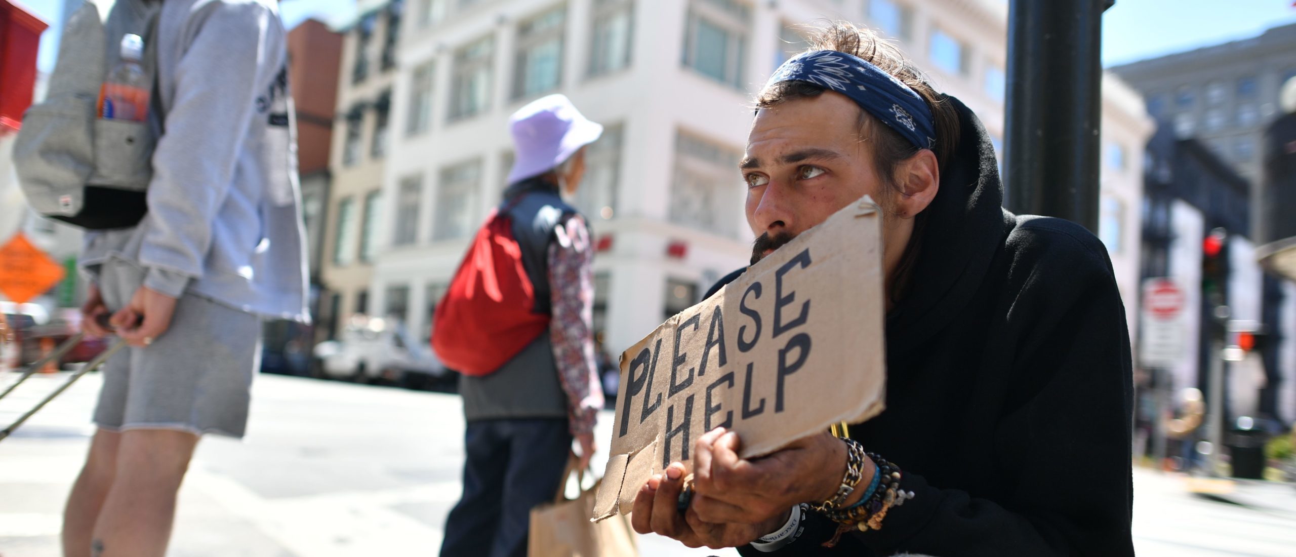 Andrew Loy begs along a sidewalk in downtown San Francisco, California on Tuesday, June, 28, 2016. Homelessness is on the rise in the city irking residents and bringing the problem under a spotlight. (Photo by Josh Edelson / AFP) (Photo credit should read JOSH EDELSON/AFP via Getty Images)