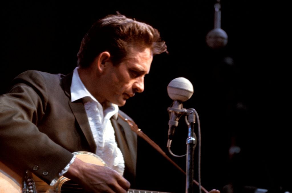 UNITED STATES - JULY 24: NEWPORT FOLK FESTIVAL Photo of Johnny CASH, Johnny Cash performing on stage (Photo by Gai Terrell/Redferns)