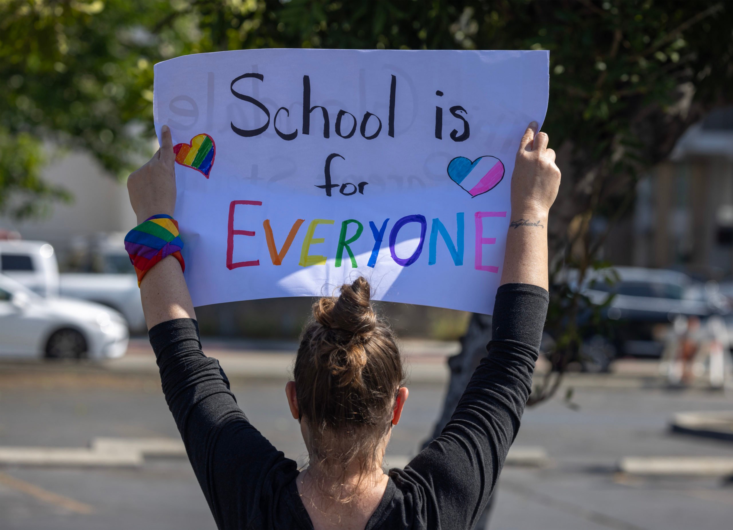 GLENDALE, CALIFORNIA - JUNE 20: A pro-LGBTQ+ demonstrator holds a sign outside a Glendale Unified School District (GUSD) Board of Education meeting on June 20, 2023 in Glendale, California. Coming two weeks after another GUSD board meeting where a motion was discussed to recognize June as Pride Month sparked violent protests, police were out in force to keep the sides separated. (Photo by David McNew/Getty Images)