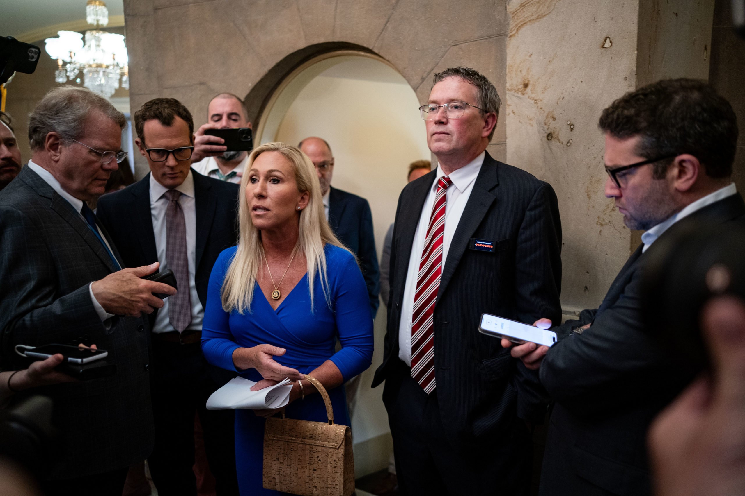 WASHINGTON, DC - MAY 7: Rep. Marjorie Taylor Greene (R-GA) and Rep. Thomas Massie (R-KY) arrive for a meeting with Speaker of the House Mike Johnson (R-LA) at the U.S. Capitol on May 7, 2024 in Washington, DC. Last week Greene threatened to move forward with a 'motion to vacate' over her dissatisfaction with the Speaker's handling of the government funding legislation. (Photo by Kent Nishimura/Getty Images)