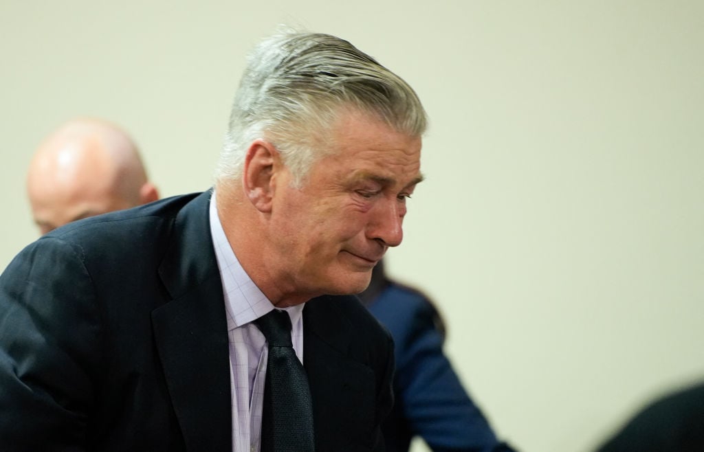 TOPSHOT - US actor Alec Baldwin gets emotional at the conclusion of his trial on involuntary manslaughter at Santa Fe County District Court in Santa Fe, New Mexico, on July 12, 2024. Baldwin's trial for involuntary manslaughter was dismissed by a judge Friday after she ruled that key evidence over a fatal shooting on the set of "Rust" had been withheld from the defense. (Photo by RAMSAY DE GIVE / POOL / AFP) (Photo by RAMSAY DE GIVE/POOL/AFP via Getty Images)