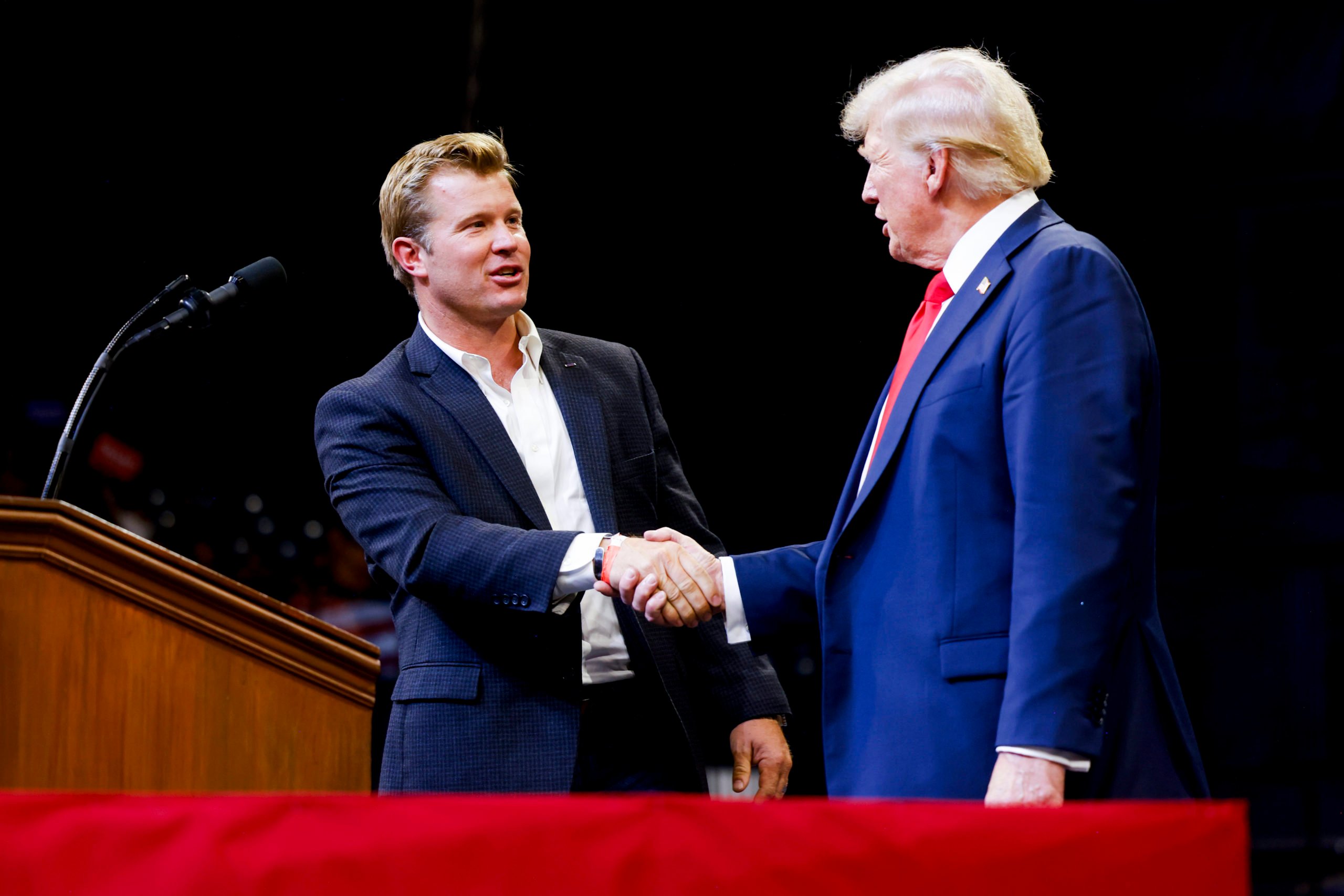 BOZEMAN, MONTANA - AUGUST 9: Montana Republican U.S. Senate candidate Tim Sheehy shakes hands with Republican presidential nominee, former U.S. President Donald Trump at a rally at the Brick Breeden Fieldhouse at Montana State University on August 9, 2024 in Bozeman, Montana. (Photo by Michael Ciaglo/Getty Images)