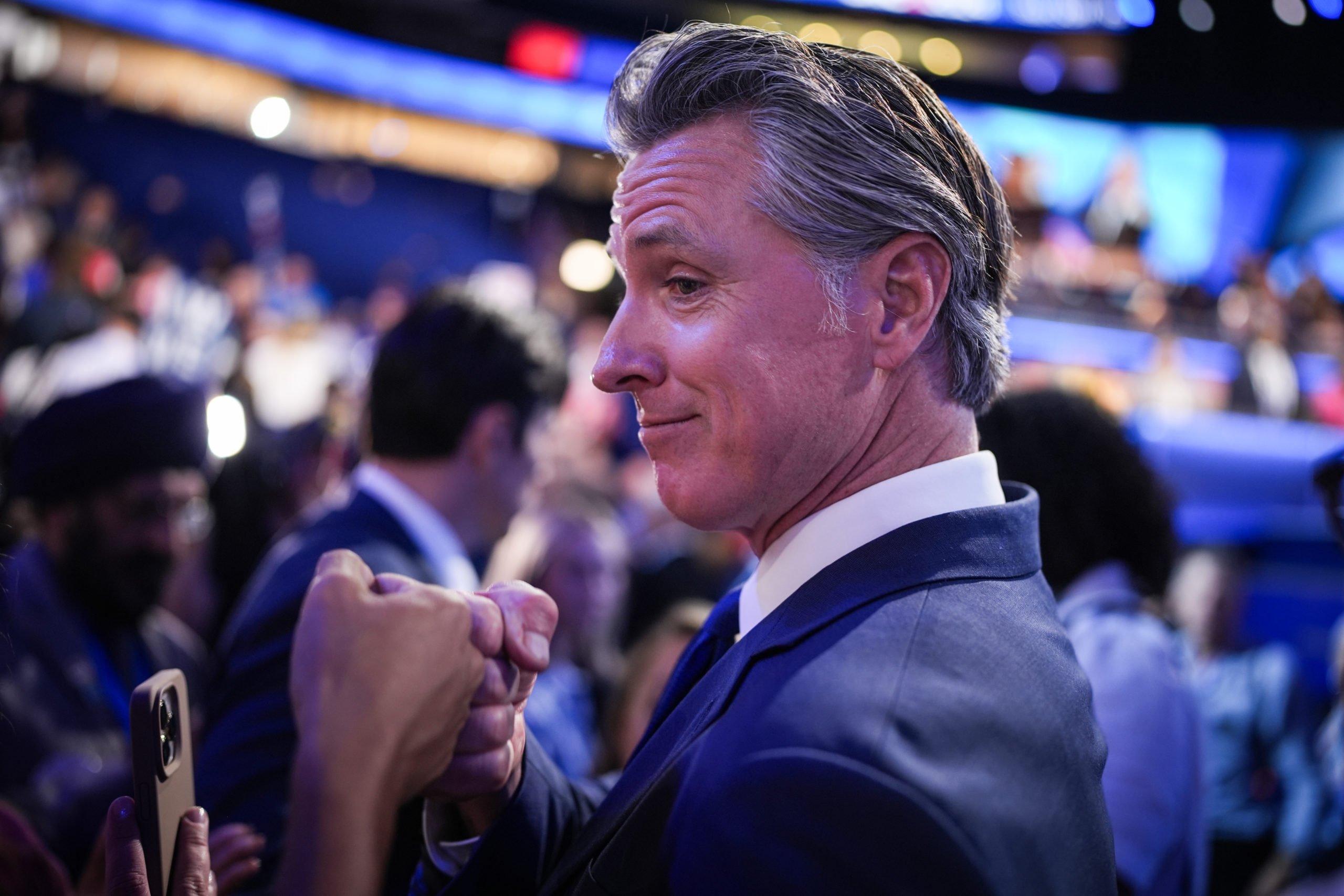 California Governor Gavin Newsom greets people during the first day of the Democratic National Convention at the United Center on August 19, 2024 in Chicago, Illinois. Delegates, politicians, and Democratic party supporters are in Chicago for the convention, concluding with current Vice President Kamala Harris accepting her party's presidential nomination. (Photo by Andrew Harnik/Getty Images)