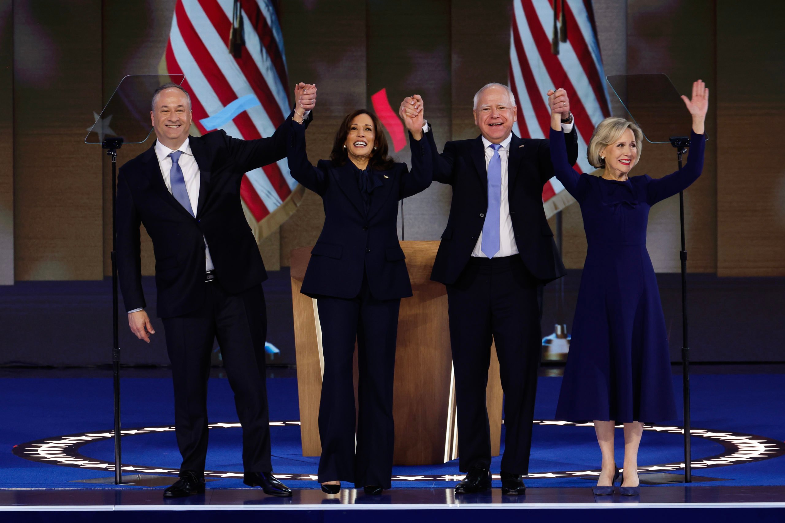 Second gentleman Doug Emhoff, Democratic presidential nominee, U.S. Vice President Kamala Harris, Democratic vice presidential nominee Minnesota Gov. Tim Walz and Minnesota first lady Gwen Walz celebrate after Harris accepted the Democratic presidential nomination during the final day of the Democratic National Convention at the United Center. (Photo by Chip Somodevilla/Getty Images)