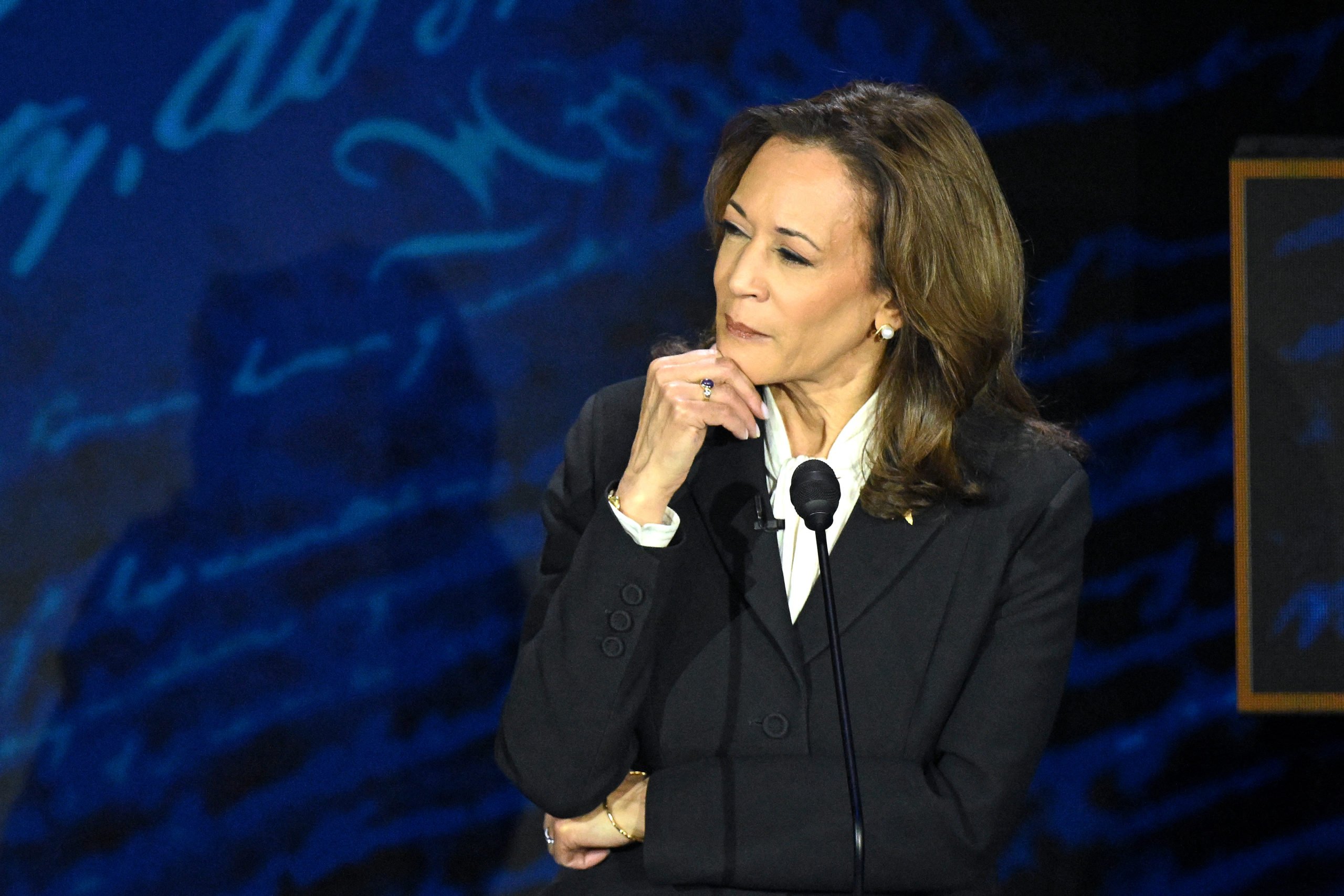 TOPSHOT - US Vice President and Democratic presidential candidate Kamala Harris listens as former US President and Republican presidential candidate Donald Trump speaks during a presidential debate at the National Constitution Center in Philadelphia, Pennsylvania, on September 10, 2024. (Photo by SAUL LOEB / AFP) (Photo by SAUL LOEB/AFP via Getty Images)