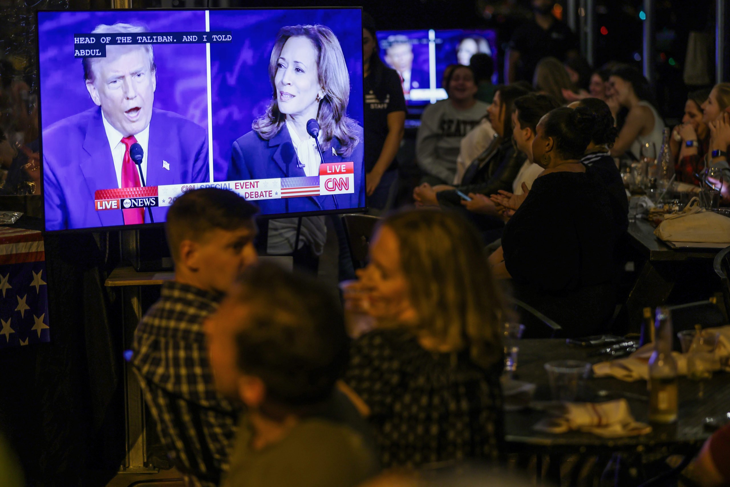 People watch the presidential debate during a debate watch party at Shaw’s Tavern on September 10, 2024 in Washington, DC. Democratic presidential nominee, U.S. Vice President Kamala Harris and Republican presidential nominee, former President Donald Trump face off in their first debate Tuesday evening at The National Constitution Center in Philadelphia, Pennsylvania. (Photo by Alex Wong/Getty Images)