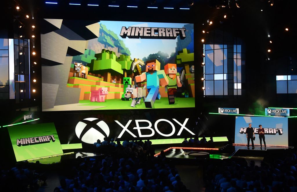 Lydia Winters (R) and Sax Persson speak about Minecraft during Microsoft's E3 2016 Xbox press conference at the Galen Center in Los Angeles, California on June 13, 2016, where the latest titles for Xbox were introduced one day ahead of the start of the 2016 Electronic Entertainment Expo, or E3, at the LA Convention Center. (Photo by FREDERIC J. BROWN / AFP) (Photo by FREDERIC J. BROWN/AFP via Getty Images)